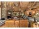 Open living area with a large stone fireplace and hardwood floors at 2162 Se Mill Creek Cir, Ocala, FL 34471