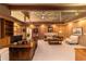 Large home office with built-in shelving and hardwood floors at 2162 Se Mill Creek Cir, Ocala, FL 34471