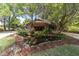 House with pond and lush landscaping in front at 2162 Se Mill Creek Cir, Ocala, FL 34471