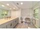 Updated bathroom with modern vanity, large mirror, and walk-in shower at 2162 Se Mill Creek Cir, Ocala, FL 34471