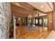 Spacious entry featuring hardwood floors and a stone fireplace at 2162 Se Mill Creek Cir, Ocala, FL 34471