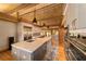 Modern kitchen with stainless steel appliances and a large island with seating at 2162 Se Mill Creek Cir, Ocala, FL 34471