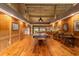 Game room features a pool table, wood paneled walls, and hardwood floors at 2162 Se Mill Creek Cir, Ocala, FL 34471