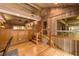 Wooden staircase with a wood railing leading to the upper level at 2162 Se Mill Creek Cir, Ocala, FL 34471