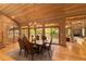 Open dining room with hardwood floors, chandelier, and views to the backyard at 2162 Se Mill Creek Cir, Ocala, FL 34471