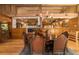 Spacious dining room with hardwood floors and views into the kitchen at 2162 Se Mill Creek Cir, Ocala, FL 34471