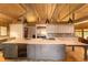 Open concept kitchen with large island, stainless steel appliances, and a wine cooler at 2162 Se Mill Creek Cir, Ocala, FL 34471