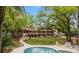 Relaxing pool area with lounge chairs and lush landscaping at 2162 Se Mill Creek Cir, Ocala, FL 34471