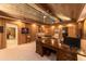 Home office with wood paneled walls, built-in shelving and seating area at 2162 Se Mill Creek Cir, Ocala, FL 34471