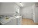 Laundry room with washer, dryer, and utility sink at 4725 Sw 62Nd St, Ocala, FL 34474