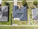Single-Gathering home with gray roof, paved patio, and fenced backyard at 4725 Sw 62Nd St, Ocala, FL 34474