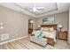 Primary bedroom with light walls, wood-look floors and large windows at 5662 Nw 40Th Pl, Ocala, FL 34482