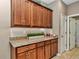 Kitchen with wood cabinets, granite countertops and a walk-in pantry at 5662 Nw 40Th Pl, Ocala, FL 34482