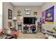 Bonus room with TV, seating, and sports memorabilia at 5662 Nw 40Th Pl, Ocala, FL 34482