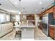 Spacious kitchen boasts granite countertops and stainless steel appliances at 5662 Nw 40Th Pl, Ocala, FL 34482