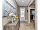 Bright and airy entryway with tile flooring and stylish decor at 5662 Nw 40Th Pl, Ocala, FL 34482