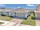 Single-Gathering home with two-car garage and landscaped front yard at 5662 Nw 40Th Pl, Ocala, FL 34482