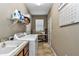 Bright laundry room with washer, dryer, and storage at 5662 Nw 40Th Pl, Ocala, FL 34482