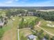 Aerial view of a golf course with ponds and lush greenery at 5662 Nw 40Th Pl, Ocala, FL 34482
