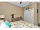 Bedroom with a queen-size bed, dresser, and neutral decor at 5662 Nw 40Th Pl, Ocala, FL 34482