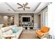 Living room with a built-in entertainment center and comfortable seating at 5662 Nw 40Th Pl, Ocala, FL 34482