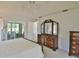 Spacious bedroom with wooden furniture and access to patio at 2093 Nw 50Th Cir, Ocala, FL 34482