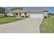 One-story home with attached garage and landscaping at 2093 Nw 50Th Cir, Ocala, FL 34482