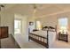 Main bedroom with a ceiling fan, double dresser, and en-suite bathroom at 2093 Nw 50Th Cir, Ocala, FL 34482
