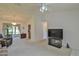 Bright living room features a vaulted ceiling and sliding glass doors to patio at 2093 Nw 50Th Cir, Ocala, FL 34482