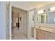 Double vanity bathroom with updated light fixtures at 2093 Nw 50Th Cir, Ocala, FL 34482