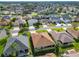 Aerial view of a residential neighborhood with houses and landscaping at 1757 Millwood Way, The Villages, FL 32162