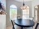 Casual dining area with a round table and arched windows at 1757 Millwood Way, The Villages, FL 32162