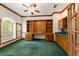 Spacious home office with built-in wooden shelving and desk at 7086 Se 12Th Cir, Ocala, FL 34480
