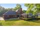 Brick house with a large backyard and screened pool at 7086 Se 12Th Cir, Ocala, FL 34480