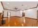Bright living room with hardwood floors and a view of the staircase at 7086 Se 12Th Cir, Ocala, FL 34480