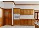 Kitchen features wood cabinets and a built-in oven at 7086 Se 12Th Cir, Ocala, FL 34480