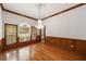 Formal dining room with hardwood floors and wood wainscoting at 7086 Se 12Th Cir, Ocala, FL 34480