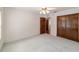 Bright bedroom with wood closets and carpet flooring at 7086 Se 12Th Cir, Ocala, FL 34480