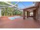 Spacious screened pool and brick patio at 7086 Se 12Th Cir, Ocala, FL 34480