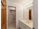 Bright bathroom with vanity, sink, and shower/tub combo at 7086 Se 12Th Cir, Ocala, FL 34480