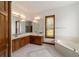 Elegant bathroom with double vanity and a large bathtub at 7086 Se 12Th Cir, Ocala, FL 34480