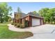 Brick house with attached garage and landscaping at 7086 Se 12Th Cir, Ocala, FL 34480