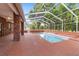 Screened pool and brick patio area at 7086 Se 12Th Cir, Ocala, FL 34480