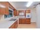 Well-equipped kitchen boasting ample cabinetry, modern appliances, and a window overlooking the backyard at 735 Se 22Nd Ave, Ocala, FL 34471