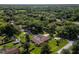 Aerial view showcasing home, pool, and surrounding landscape at 735 Se 22Nd Ave, Ocala, FL 34471