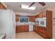Spacious kitchen offering lots of counter space, wood cabinets, and a ceiling fan at 735 Se 22Nd Ave, Ocala, FL 34471