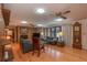 Living room with hardwood floors, fireplace and pool view at 735 Se 22Nd Ave, Ocala, FL 34471