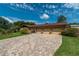 Brick home with three-car garage and paver driveway at 735 Se 22Nd Ave, Ocala, FL 34471