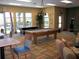 Community room with pool tables and seating area at 5598 Sw 39Th St, Ocala, FL 34474