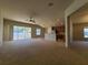 Spacious living area with sliding doors to a patio and kitchen access at 5598 Sw 39Th St, Ocala, FL 34474